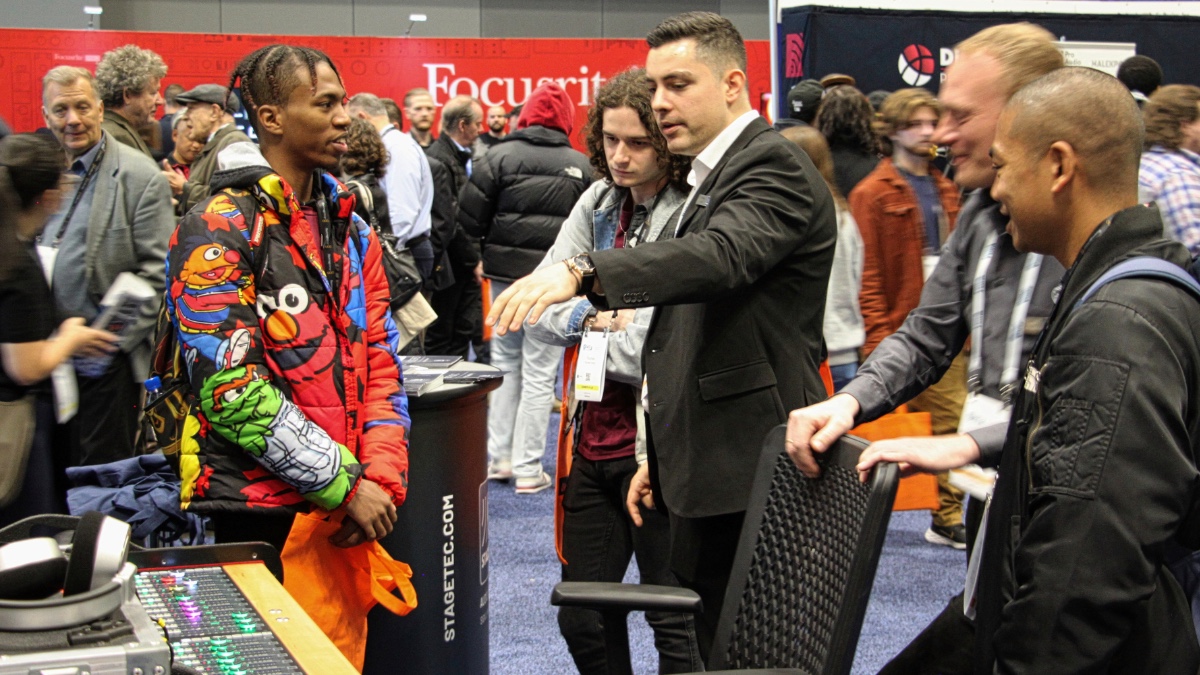Attendees interact with exhibitors on the bustling show floor during the AES New York 2022 Convention in-person events held at the Javits Center.