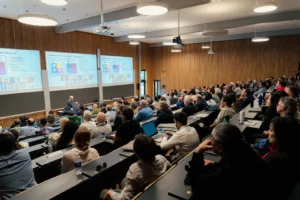 Audience listening to Dorte Hammershoi present the Richard C. Heyser Memorial Lecture during the AES 160th Convention in Copenhagen, Denmark.